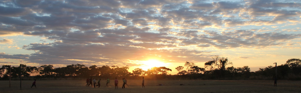 Kids play soccer until the very last drop of light disappears.